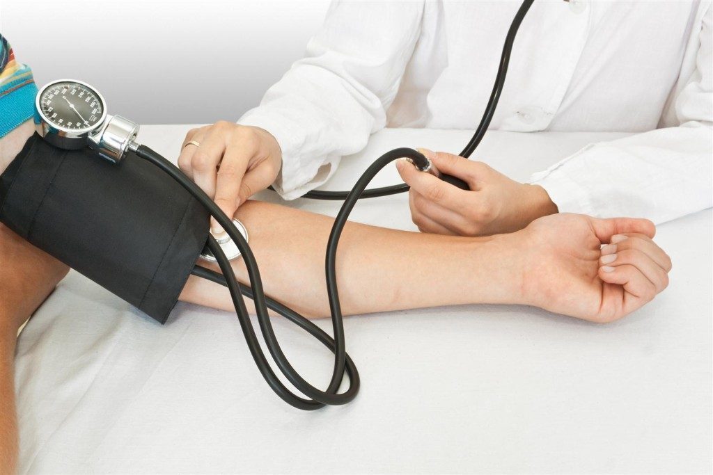 medicine concept. the doctor measures pressure in the patient